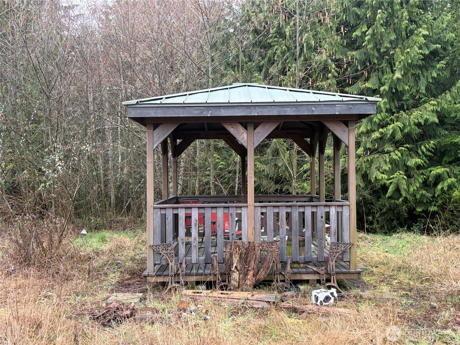 156 Whitney Road Quilcene, WA 98376 - Photo 21 of 36 a view of a wooden deck with a backyard