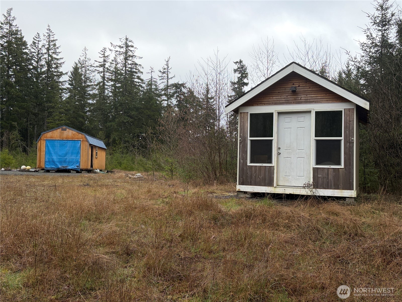 156 Whitney Road Quilcene, WA 98376 - Photo 23 of 36 a view of a house with a yard