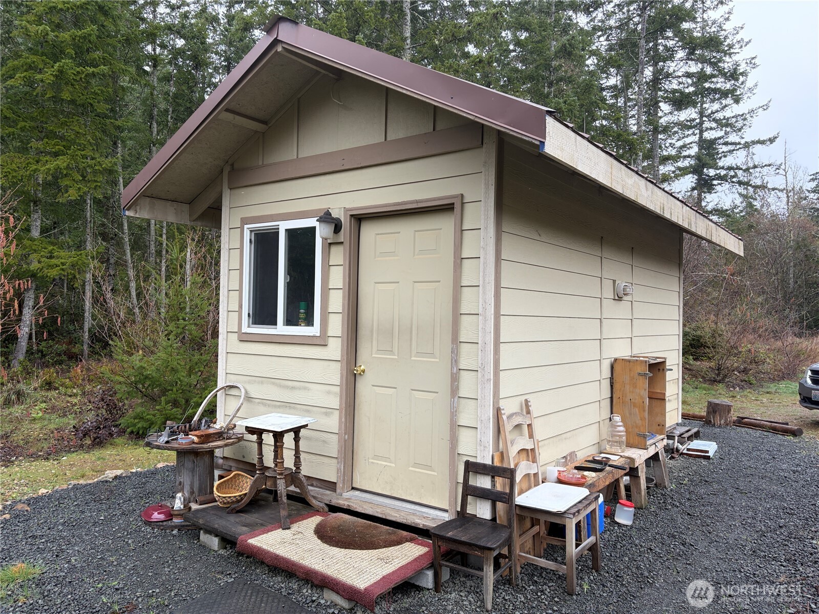 156 Whitney Road Quilcene, WA 98376 - Photo 4 of 36 a view of a chair and table in backyard of the house