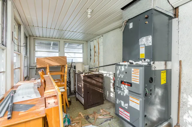 a front view of a house with outdoor seating