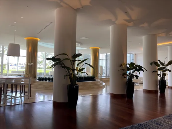 a view of a living room and entryway