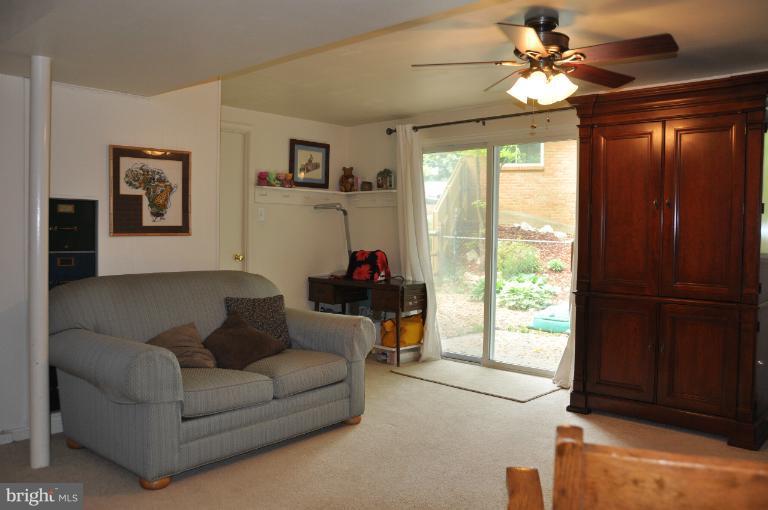 8612 Victoria Road Springfield, VA 22151 - Photo 2 of 25 a living room with furniture and a window