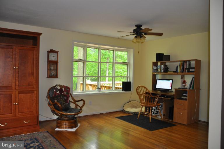 8612 Victoria Road Springfield, VA 22151 - Photo 17 of 25 a view of a workspace with furniture and a window