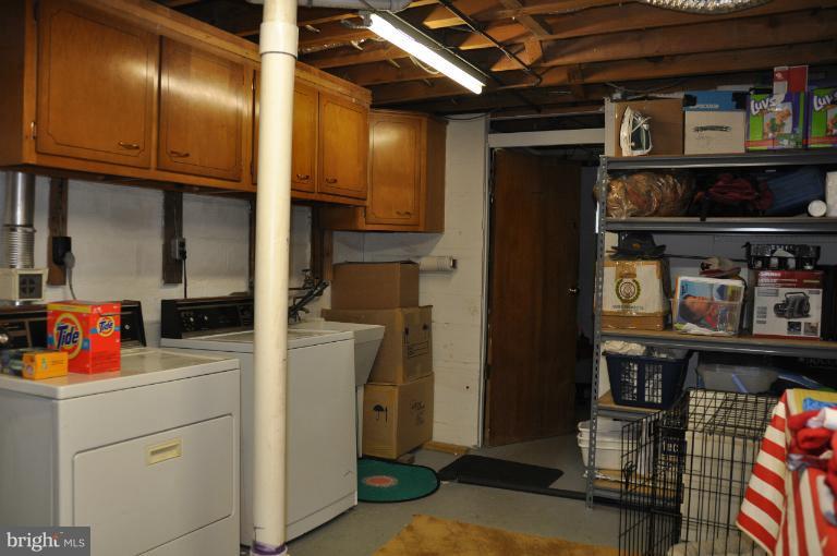 8612 Victoria Road Springfield, VA 22151 - Photo 20 of 25 a utility room with closet dryer and washer