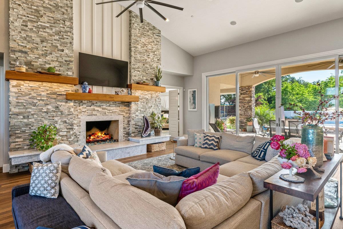 2165 West Biggs Gridley Road Gridley, CA 95948 - Photo 20 of 98 a living room with furniture a flat screen tv and a fireplace