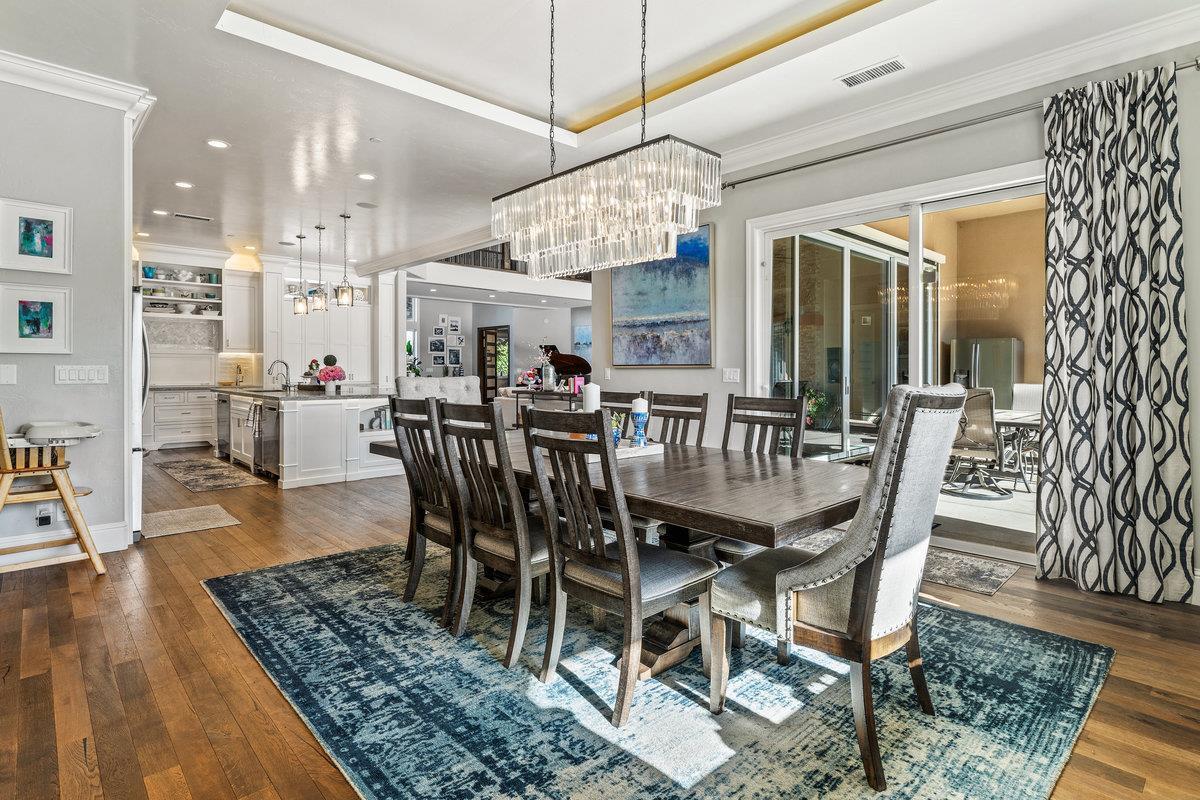 2165 West Biggs Gridley Road Gridley, CA 95948 - Photo 31 of 98 a view of a dining room with furniture wooden floor and chandelier