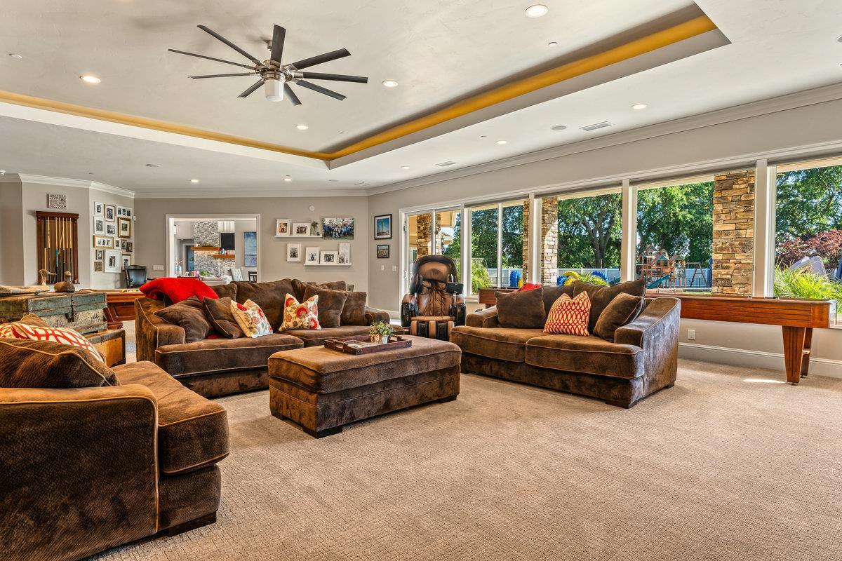 2165 West Biggs Gridley Road Gridley, CA 95948 - Photo 37 of 98 a living room with furniture a ceiling fan and a large window