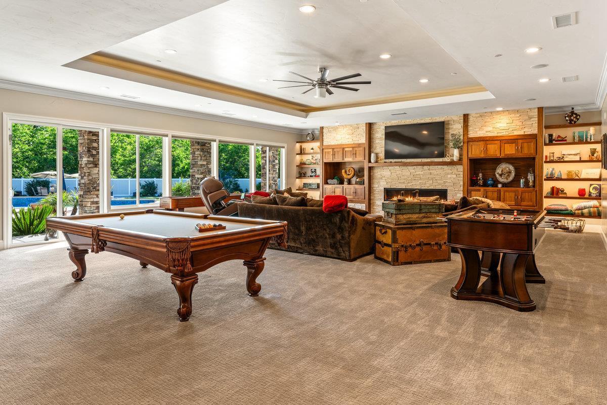 2165 West Biggs Gridley Road Gridley, CA 95948 - Photo 39 of 98 a living room with furniture a flat screen tv and a large window