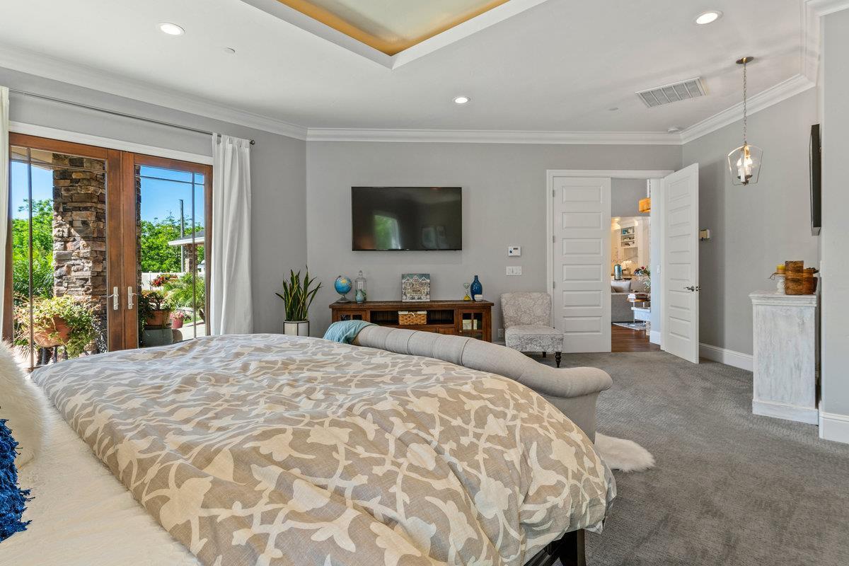 2165 West Biggs Gridley Road Gridley, CA 95948 - Photo 49 of 98 a bedroom with a large bed and a flat screen tv