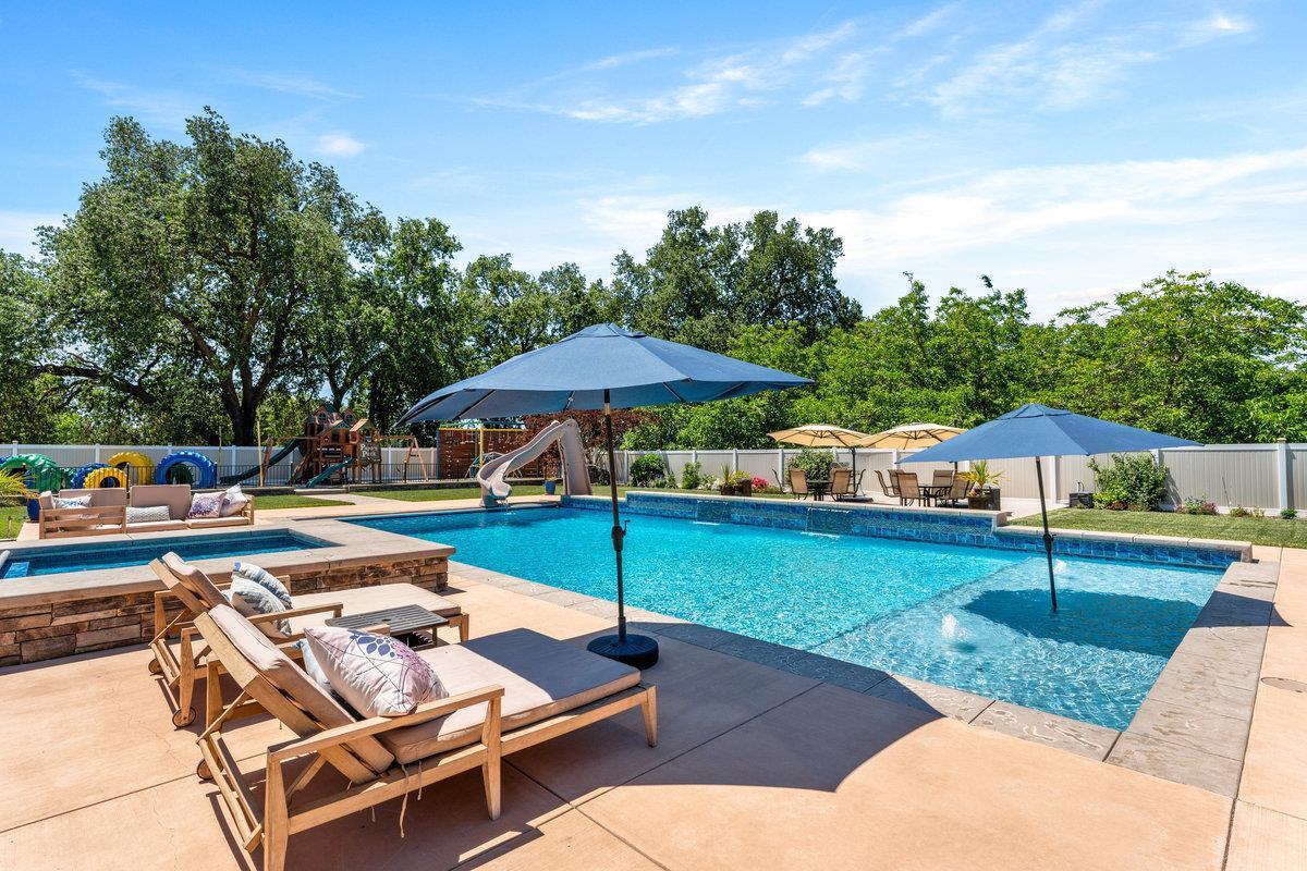 2165 West Biggs Gridley Road Gridley, CA 95948 - Photo 66 of 98 a view of a backyard with a patio and swimming pool