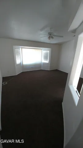 a view of empty room with windows