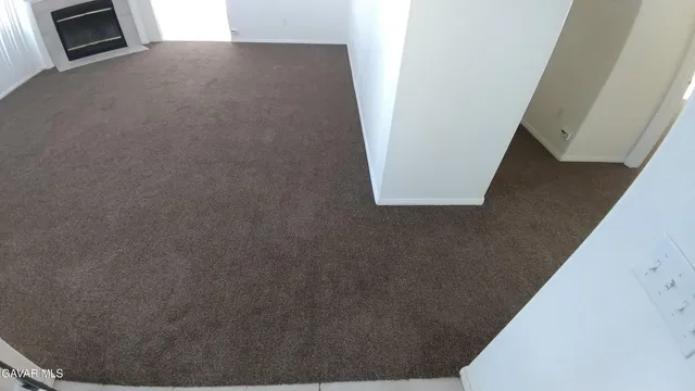 an empty room with a fireplace