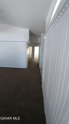 a view of a livingroom with furniture and chandelier