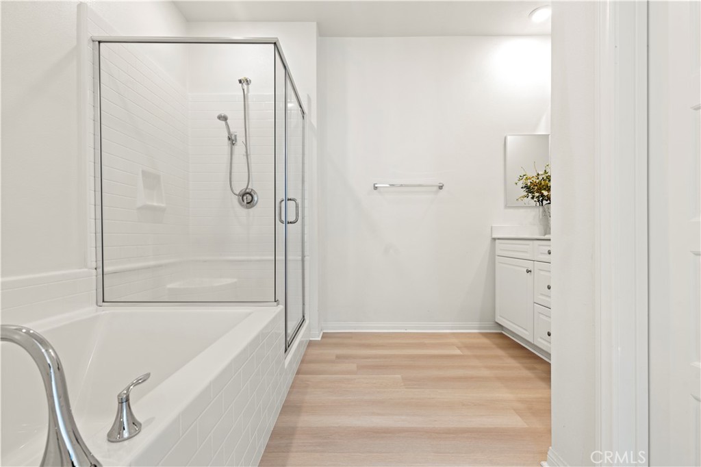 185 Steely Irvine, CA 92614 - Photo 11 of 28 a bathroom with a bathtub and a shower
