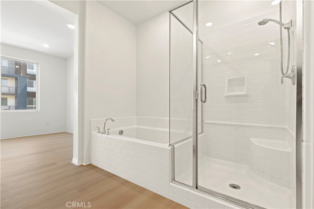 185 Steely Irvine, CA 92614 - Photo 12 of 28 a bathroom with a bathtub and a shower