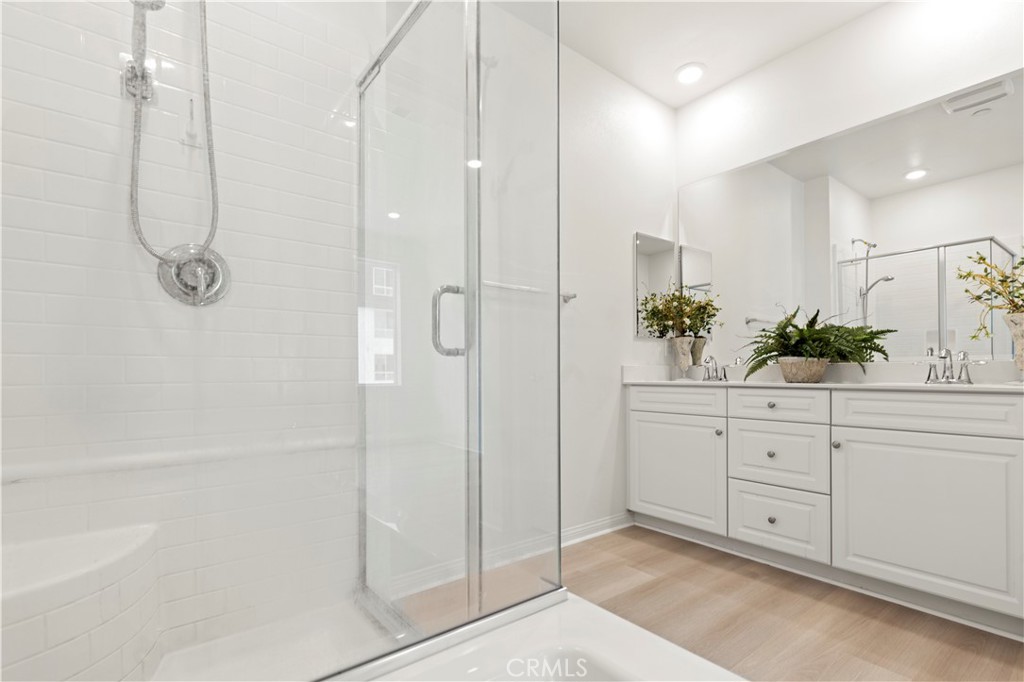 185 Steely Irvine, CA 92614 - Photo 13 of 28 a spacious bathroom with a shower and mirror