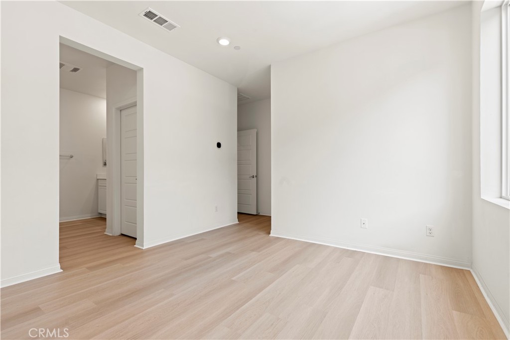 185 Steely Irvine, CA 92614 - Photo 19 of 28 an empty room with wooden floor