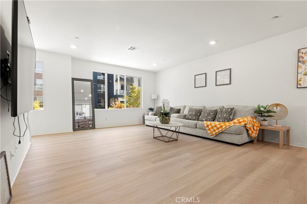 185 Steely Irvine, CA 92614 - Photo 9 of 28 a living room with furniture and large window