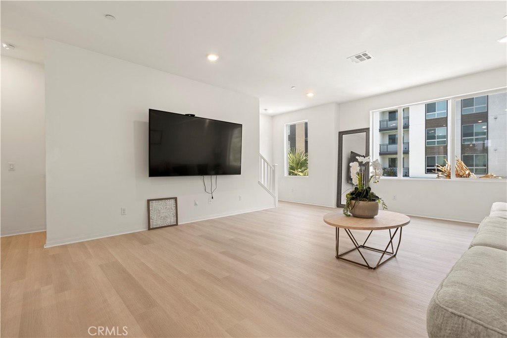 185 Steely Irvine, CA 92614 - Photo 10 of 28 a living room with furniture and a flat screen tv