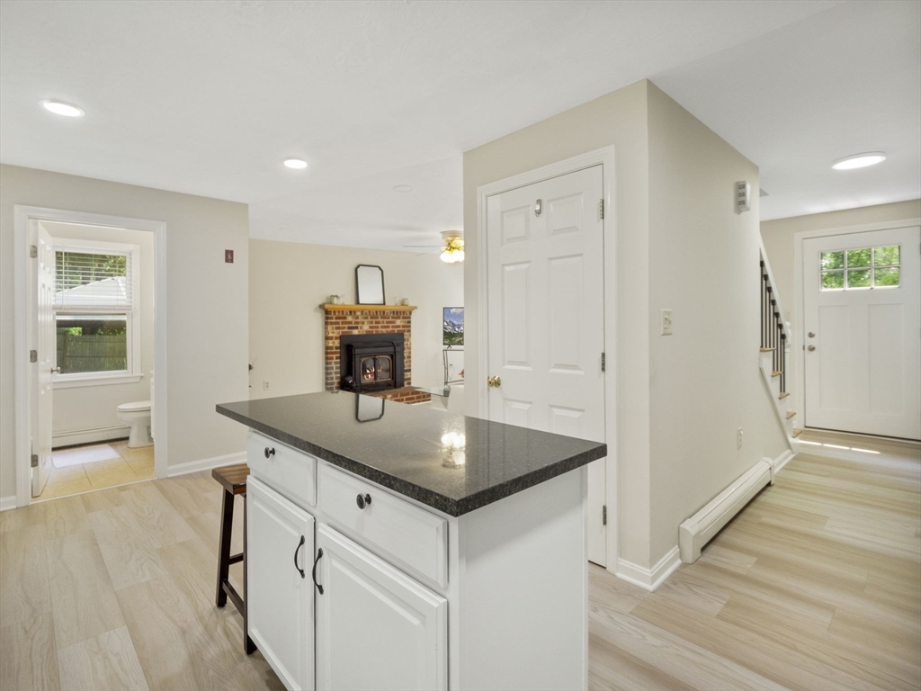 13 Plain Street Upton, MA 01568 - Photo 12 of 42 a kitchen with sink cabinets and wooden floor