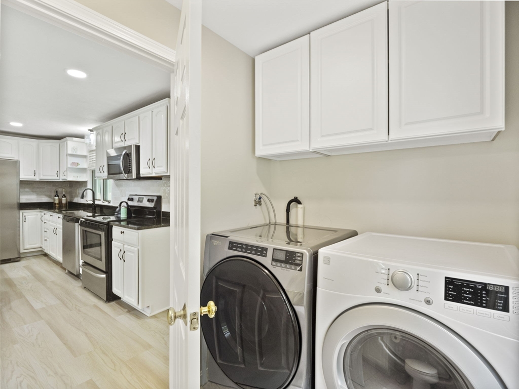 13 Plain Street Upton, MA 01568 - Photo 13 of 42 a utility room with sink dryer and washer