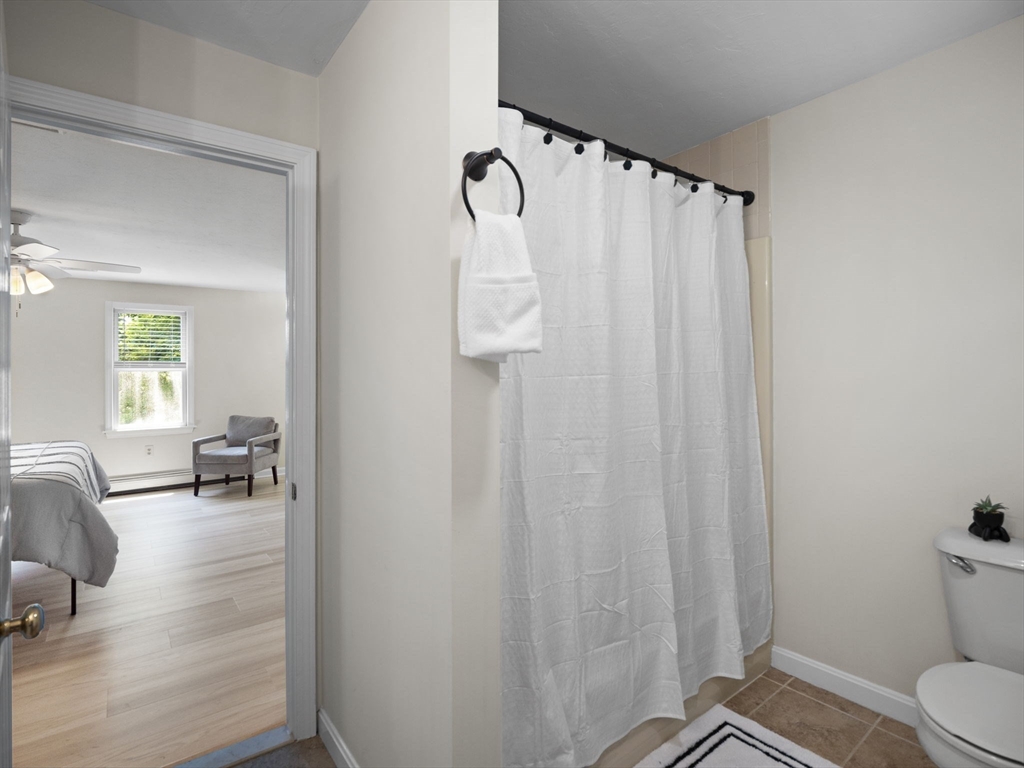 13 Plain Street Upton, MA 01568 - Photo 24 of 42 a bathroom with a sink toilet and shower