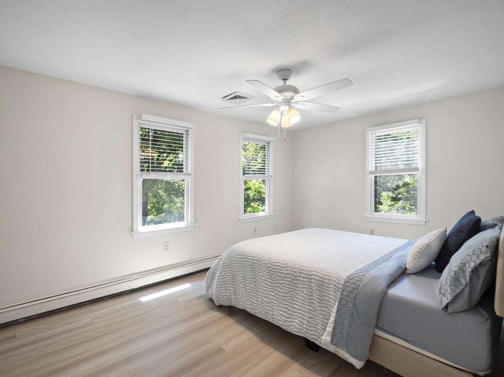 13 Plain Street Upton, MA 01568 - Photo 28 of 42 a bedroom with a bed window and a window