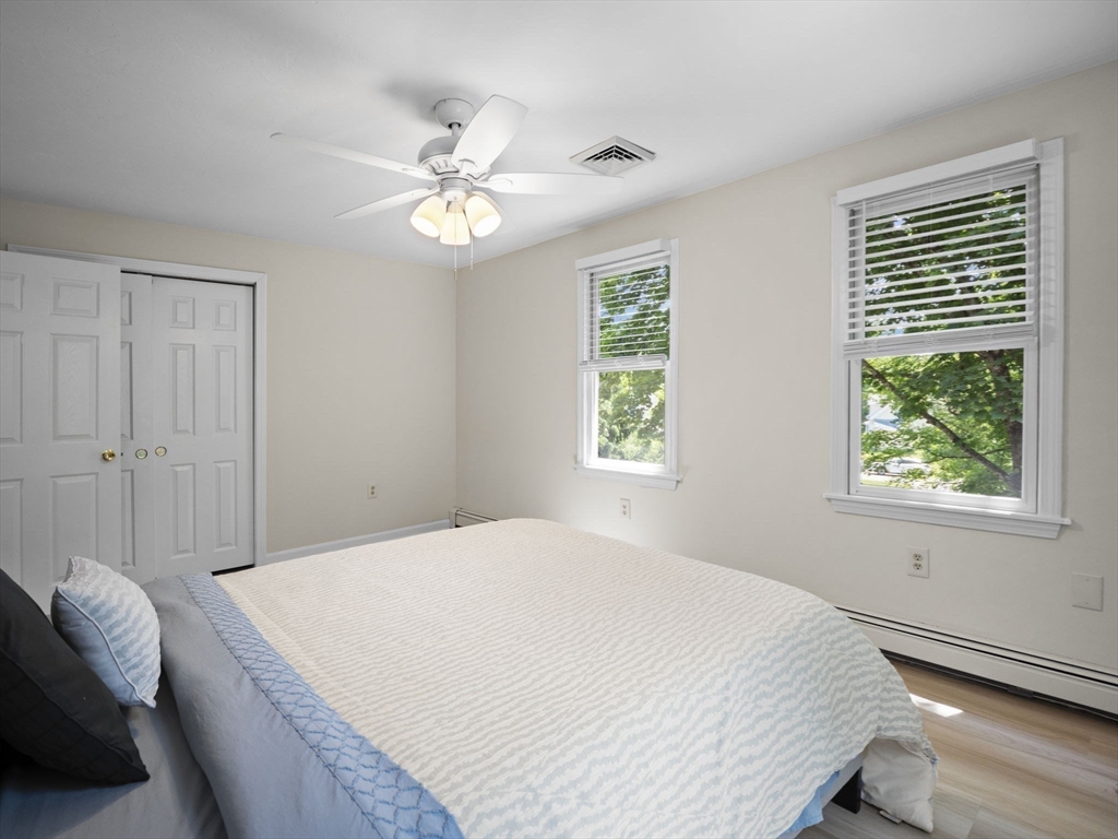 13 Plain Street Upton, MA 01568 - Photo 30 of 42 a bedroom with a bed and a window