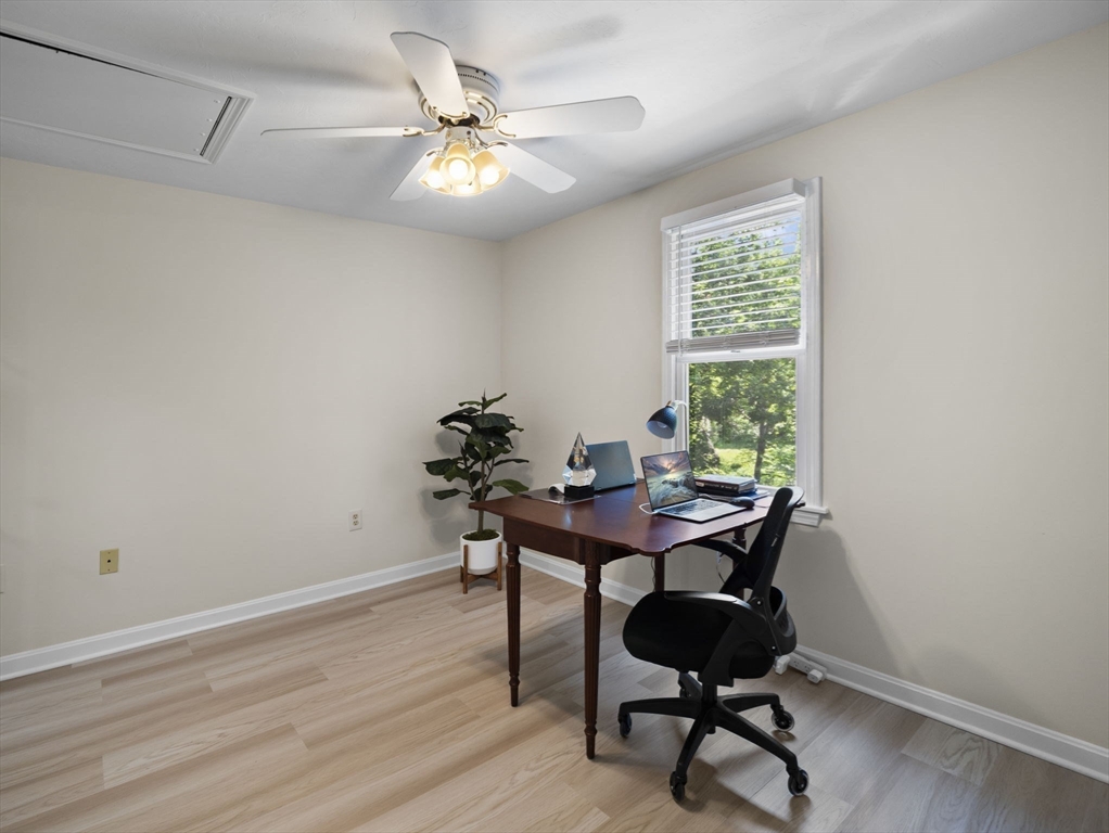 13 Plain Street Upton, MA 01568 - Photo 34 of 42 a view of a workspace with furniture and a window