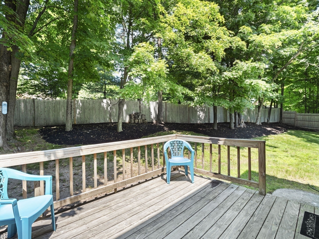 13 Plain Street Upton, MA 01568 - Photo 35 of 42 a view of a balcony with two chairs and wooden floor