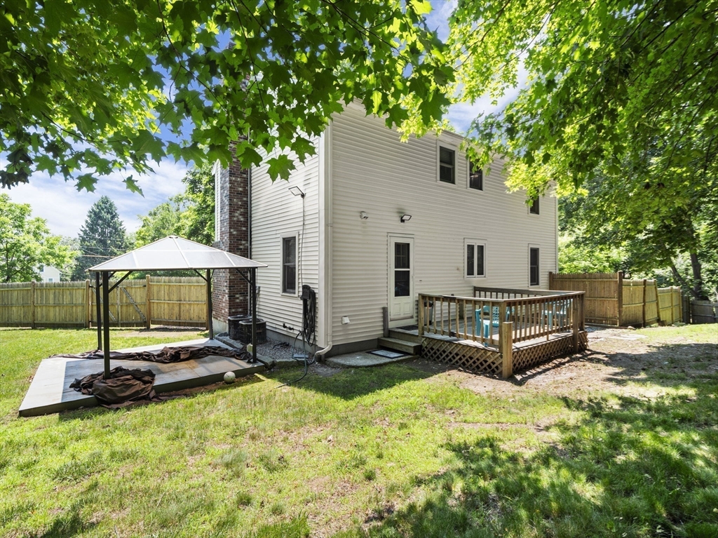13 Plain Street Upton, MA 01568 - Photo 36 of 42 a view of a backyard with a sitting area and furniture