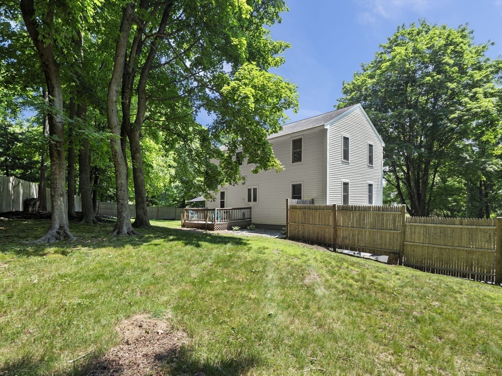13 Plain Street Upton, MA 01568 - Photo 38 of 42 a view of a house with a yard and sitting area