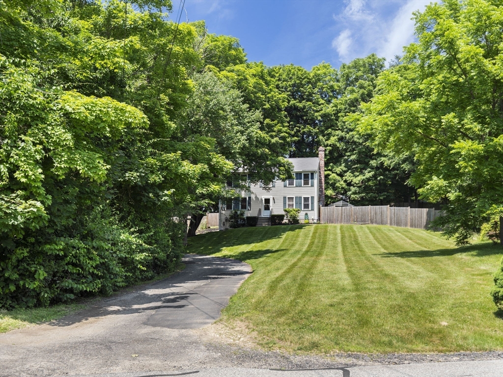 13 Plain Street Upton, MA 01568 - Photo 4 of 42 a view of a backyard with swimming pool