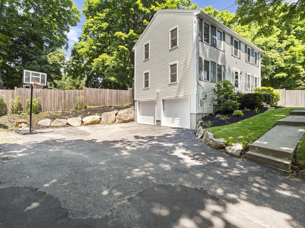 13 Plain Street Upton, MA 01568 - Photo 5 of 42 a view of a house with backyard and trees
