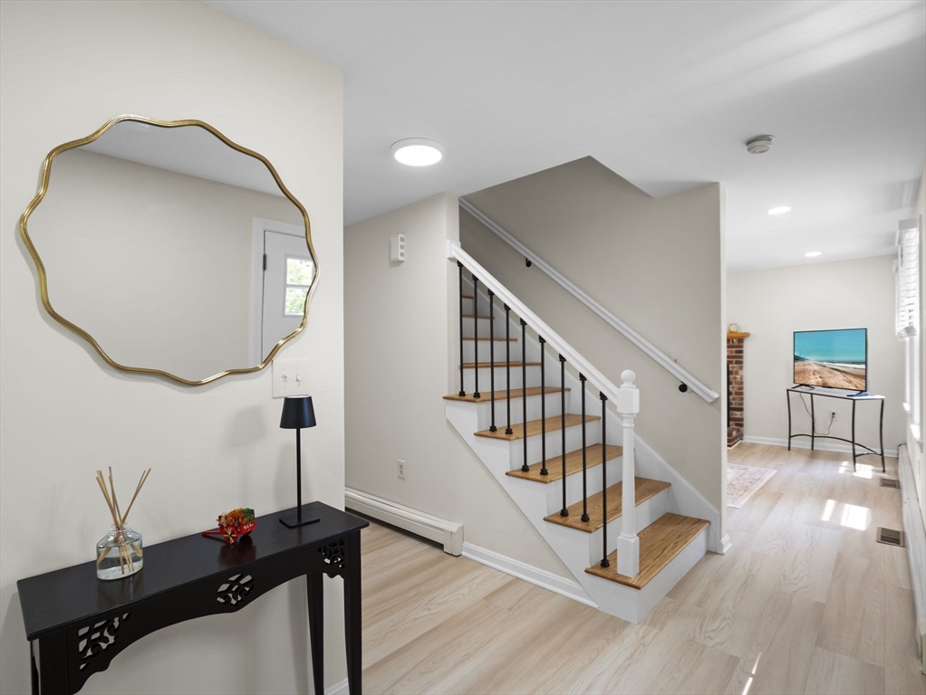 13 Plain Street Upton, MA 01568 - Photo 6 of 42 a view of a livingroom with furniture and hardwood floor