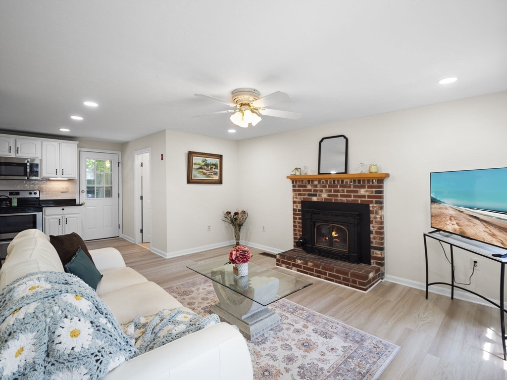 13 Plain Street Upton, MA 01568 - Photo 7 of 42 a bedroom with a bed and a fireplace