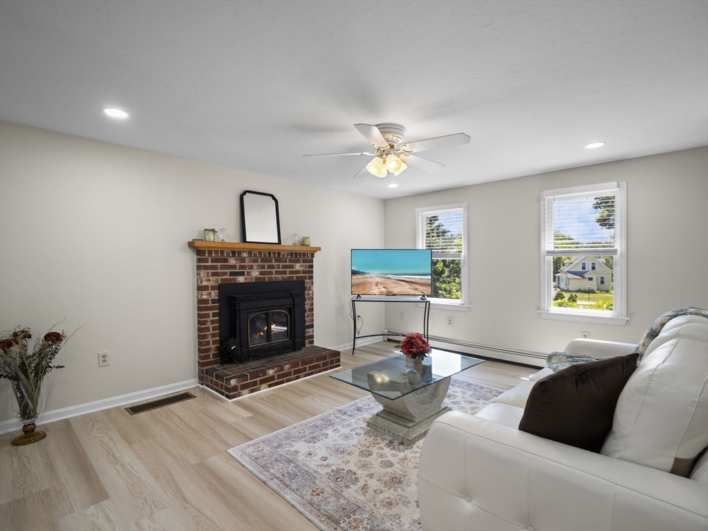 13 Plain Street Upton, MA 01568 - Photo 8 of 42 a living room with furniture and a fireplace