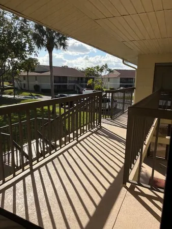 a view of balcony with furniture