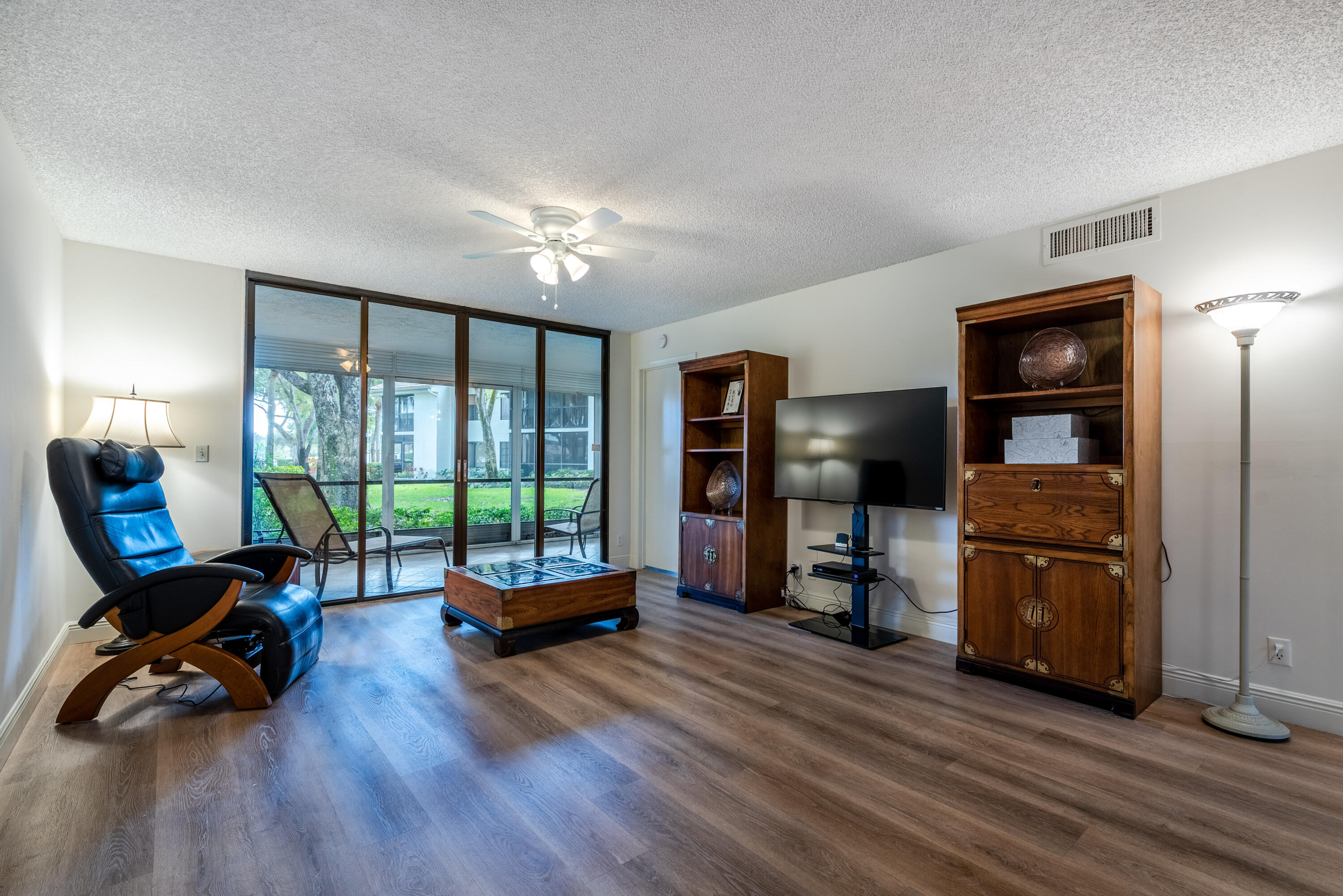 7527 Glendevon Lane, Unit 803 Delray Beach, FL 33446 - Photo 15 of 35 a living room with furniture and a large window
