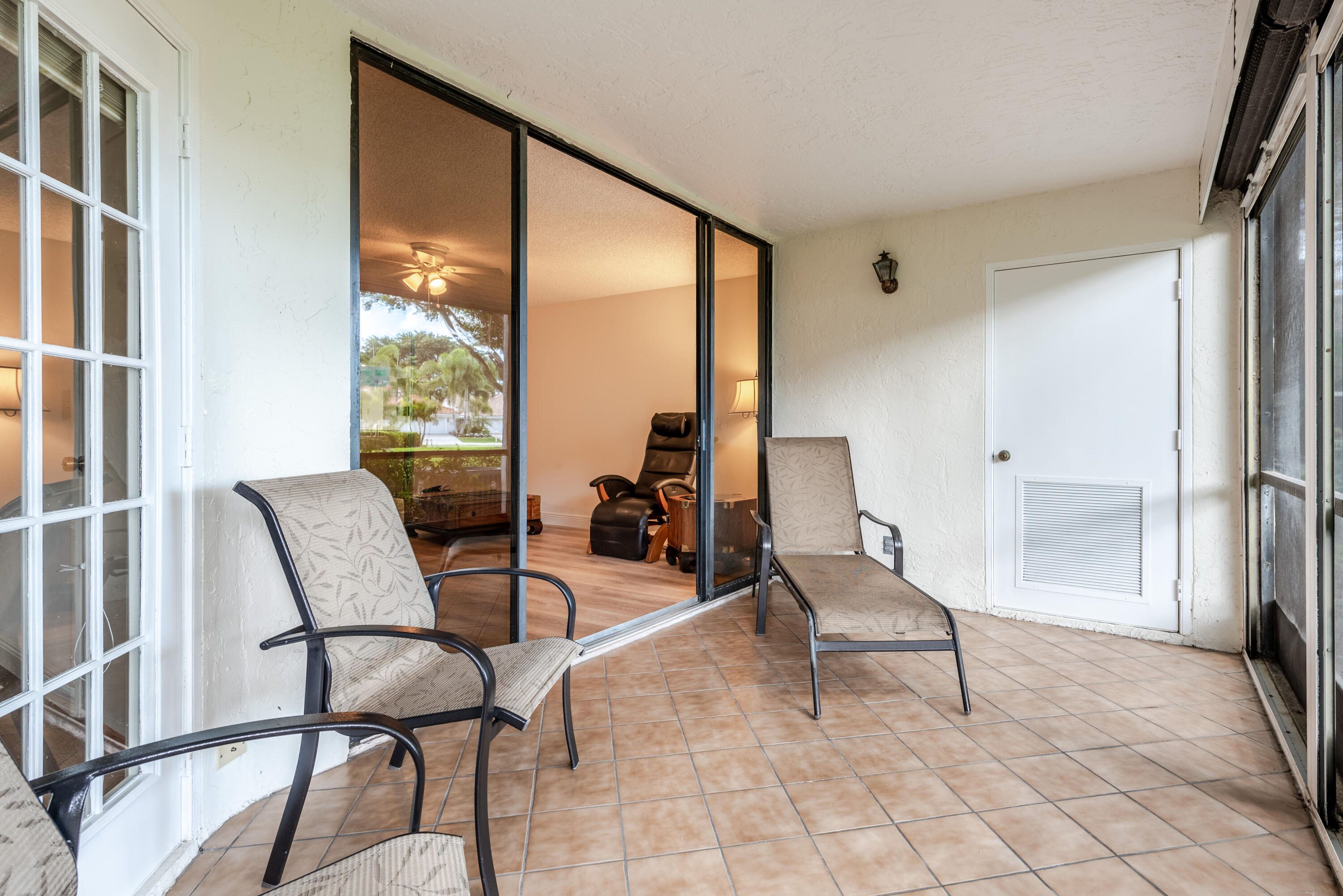 7527 Glendevon Lane, Unit 803 Delray Beach, FL 33446 - Photo 16 of 35 a living room with furniture and a large window
