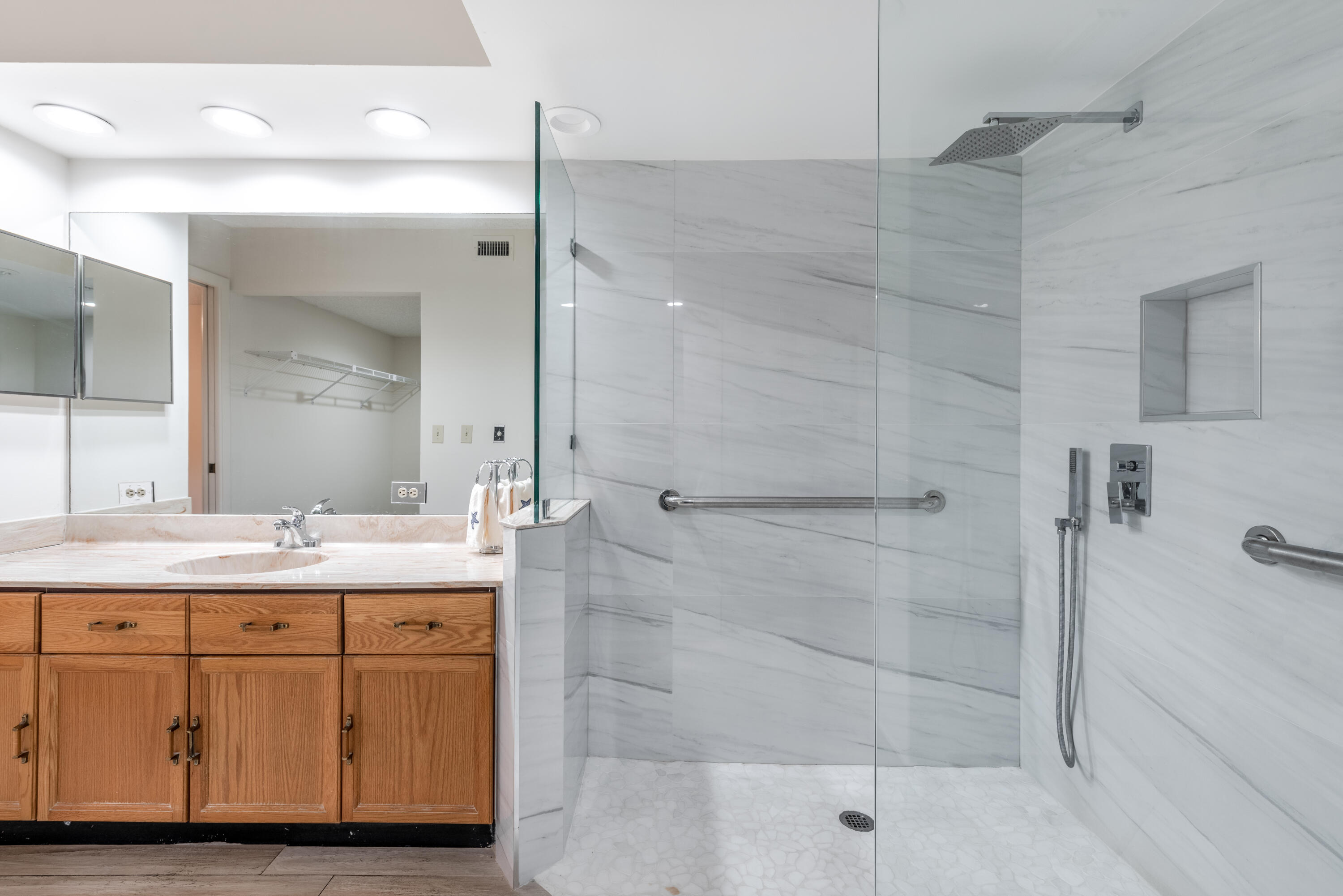 7527 Glendevon Lane, Unit 803 Delray Beach, FL 33446 - Photo 19 of 35 a bathroom with a granite countertop sink a mirror and shower