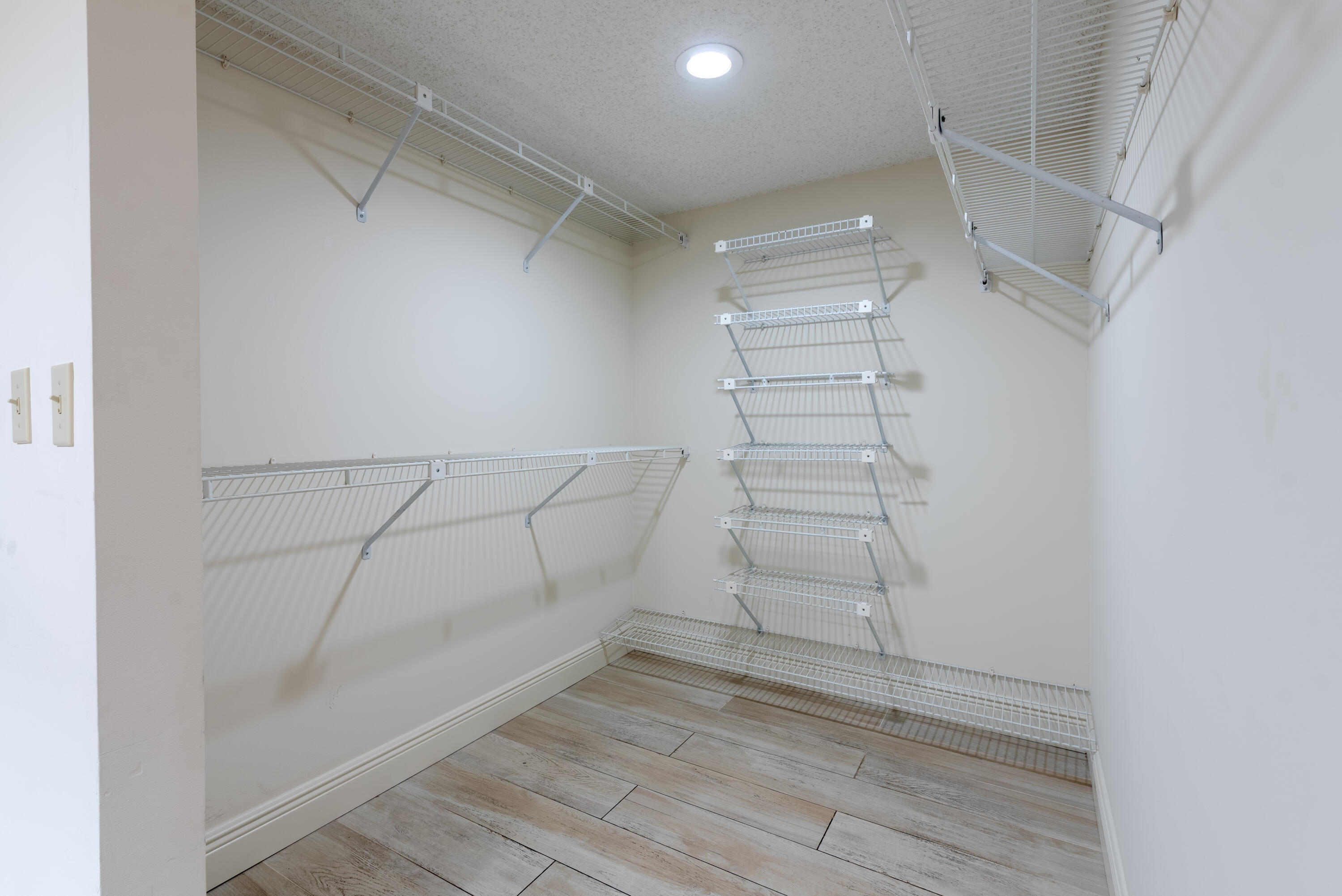 7527 Glendevon Lane, Unit 803 Delray Beach, FL 33446 - Photo 22 of 35 a view of a room with racks on the wall