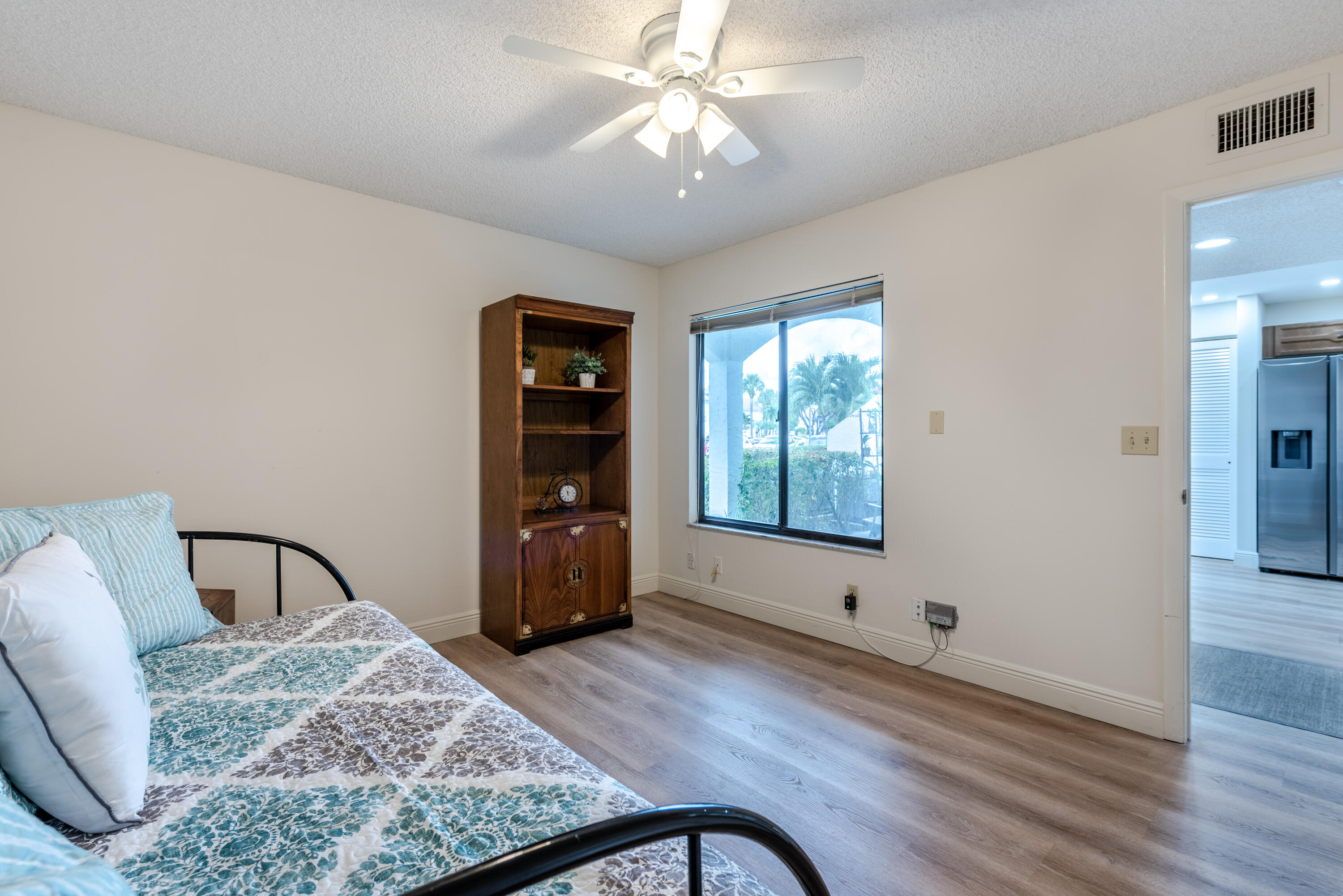 7527 Glendevon Lane, Unit 803 Delray Beach, FL 33446 - Photo 28 of 35 a living room with furniture and window