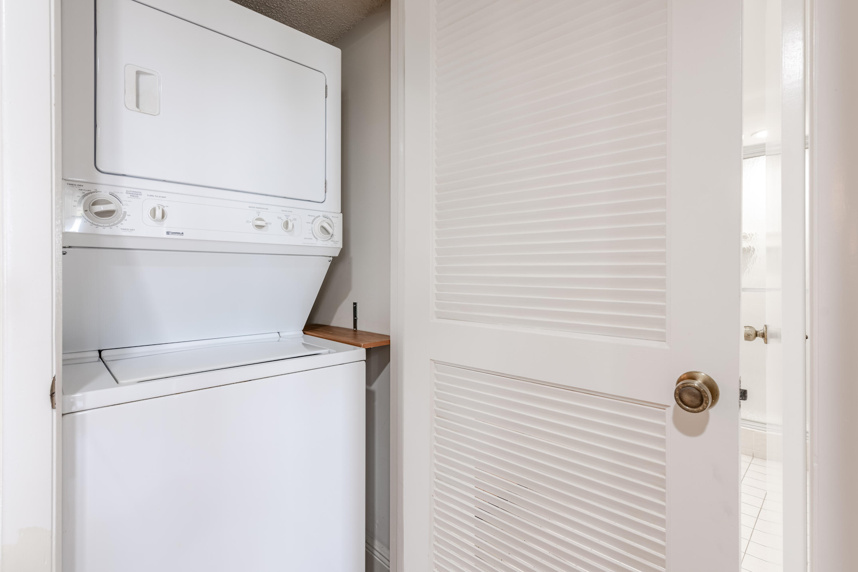 7527 Glendevon Lane, Unit 803 Delray Beach, FL 33446 - Photo 30 of 35 a close view of a washer and dryer