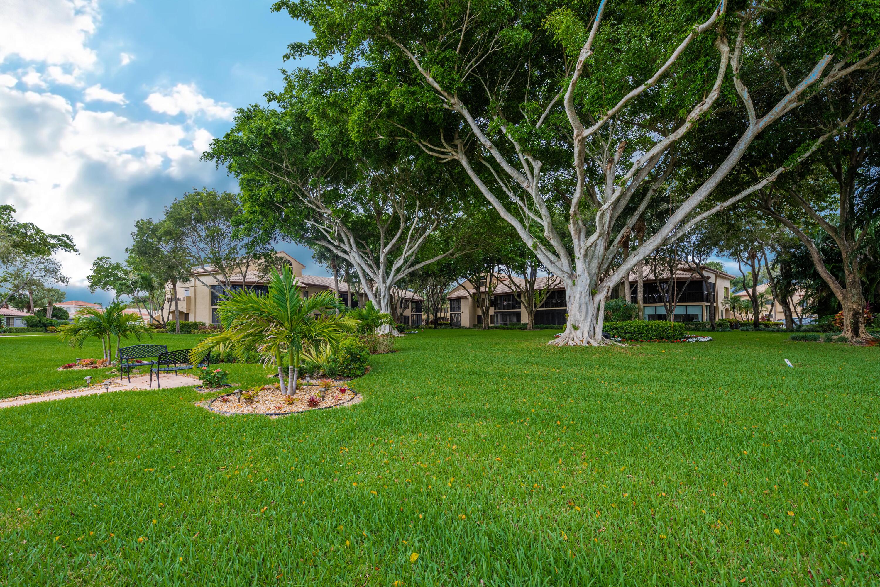 7527 Glendevon Lane, Unit 803 Delray Beach, FL 33446 - Photo 34 of 35 a view of a garden with a house