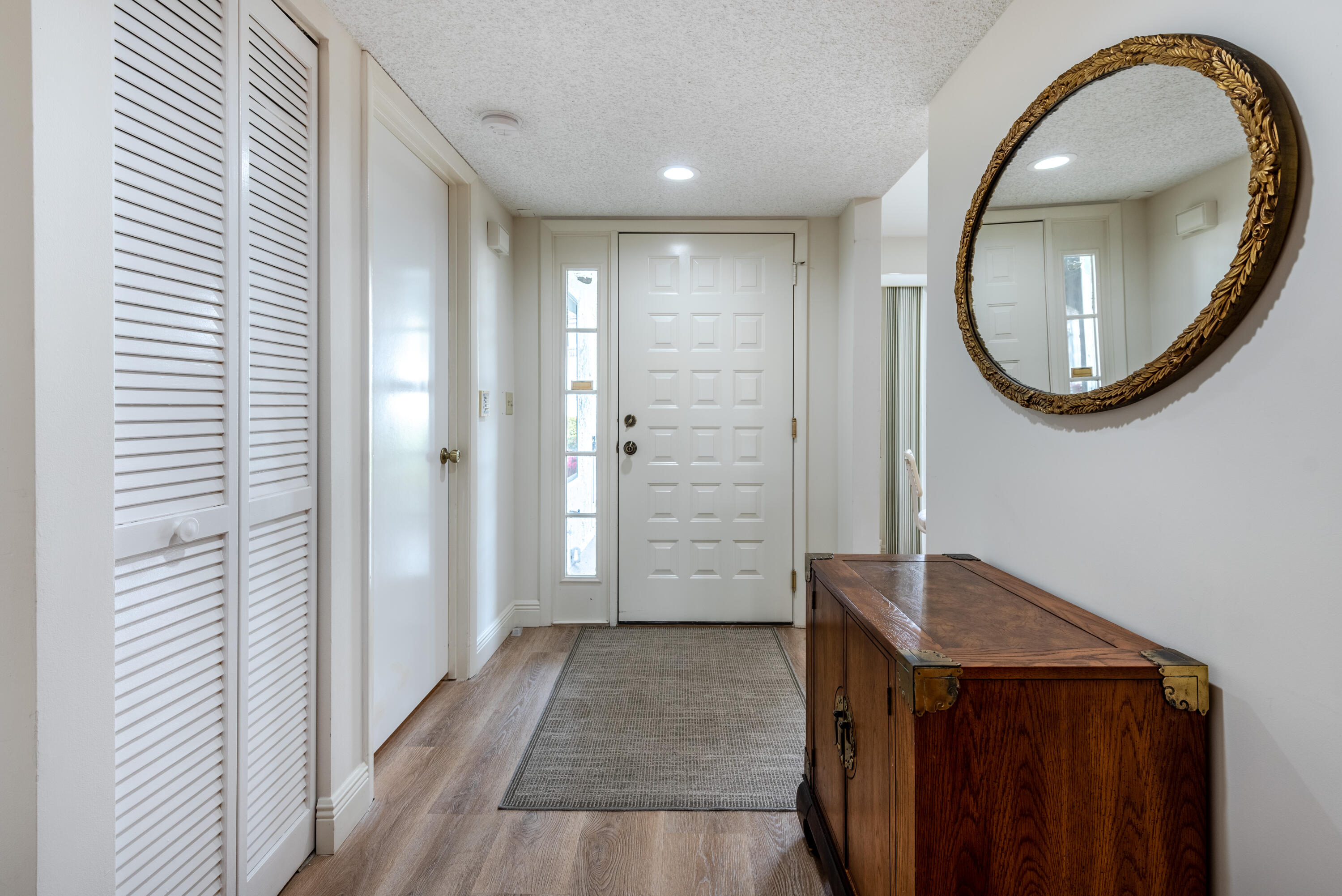 7527 Glendevon Lane, Unit 803 Delray Beach, FL 33446 - Photo 7 of 35 a view of a bathroom with a sink and a mirror
