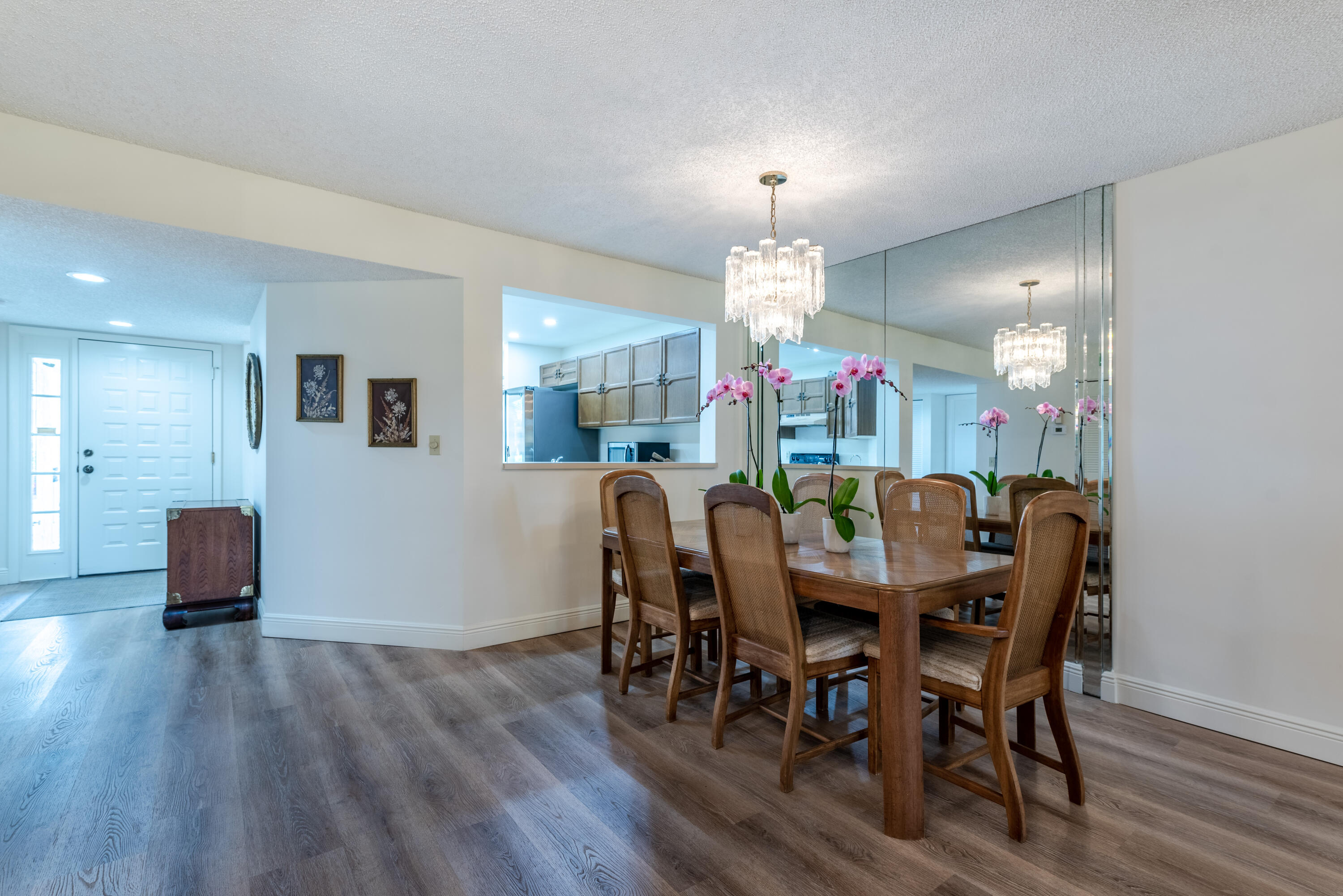 7527 Glendevon Lane, Unit 803 Delray Beach, FL 33446 - Photo 8 of 35 a view of a dining room with furniture and wooden floor