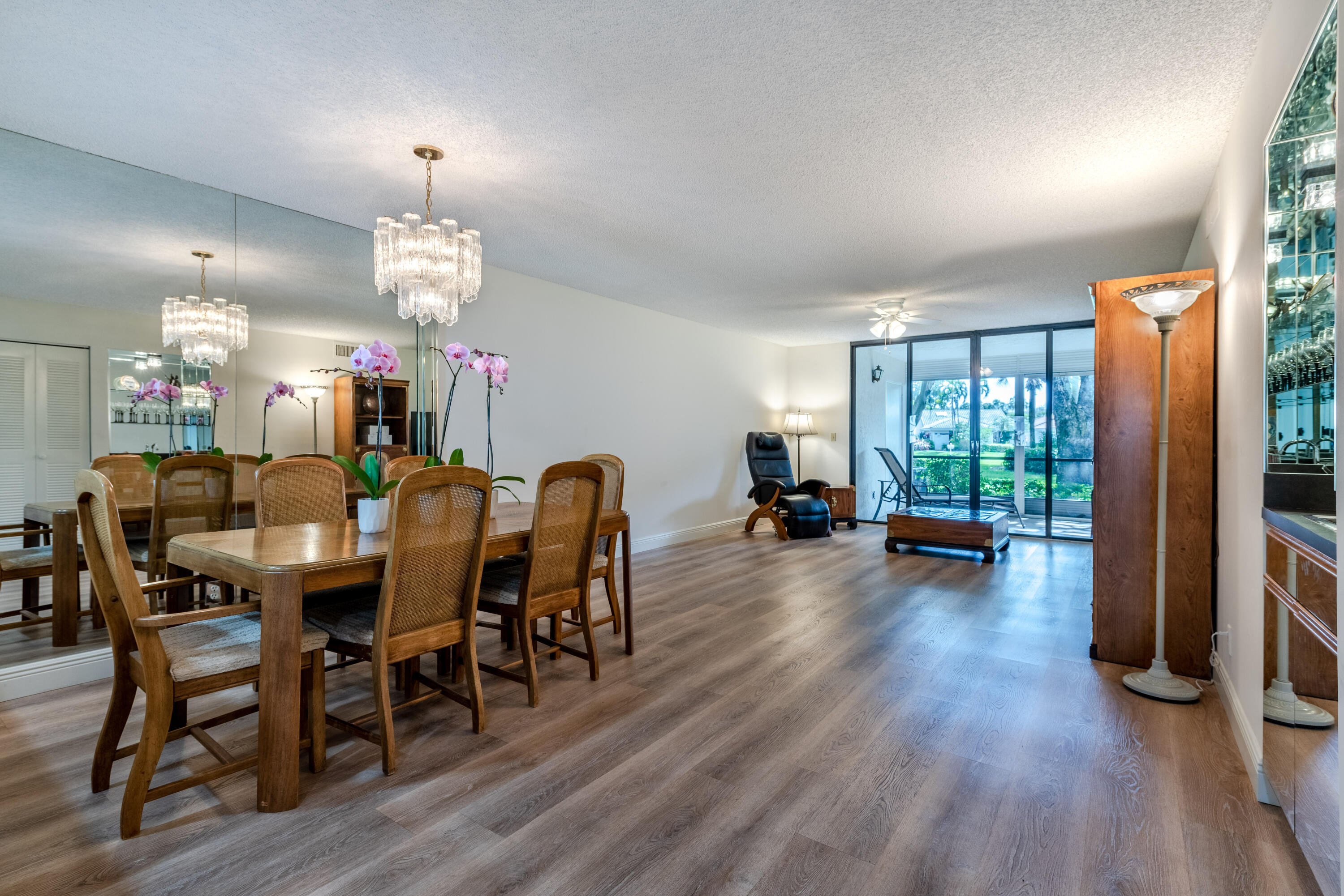 7527 Glendevon Lane, Unit 803 Delray Beach, FL 33446 - Photo 9 of 35 a view of a dining room with furniture window and wooden floor