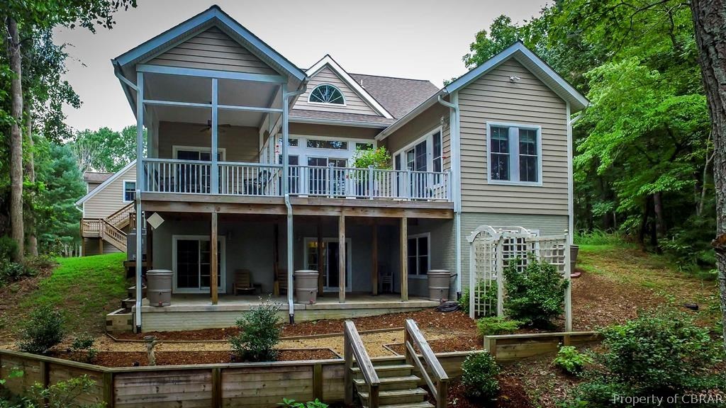 137 Mastons Wharf Road Lancaster, VA 22503 - Photo 2 of 39 a front view of a house with porch