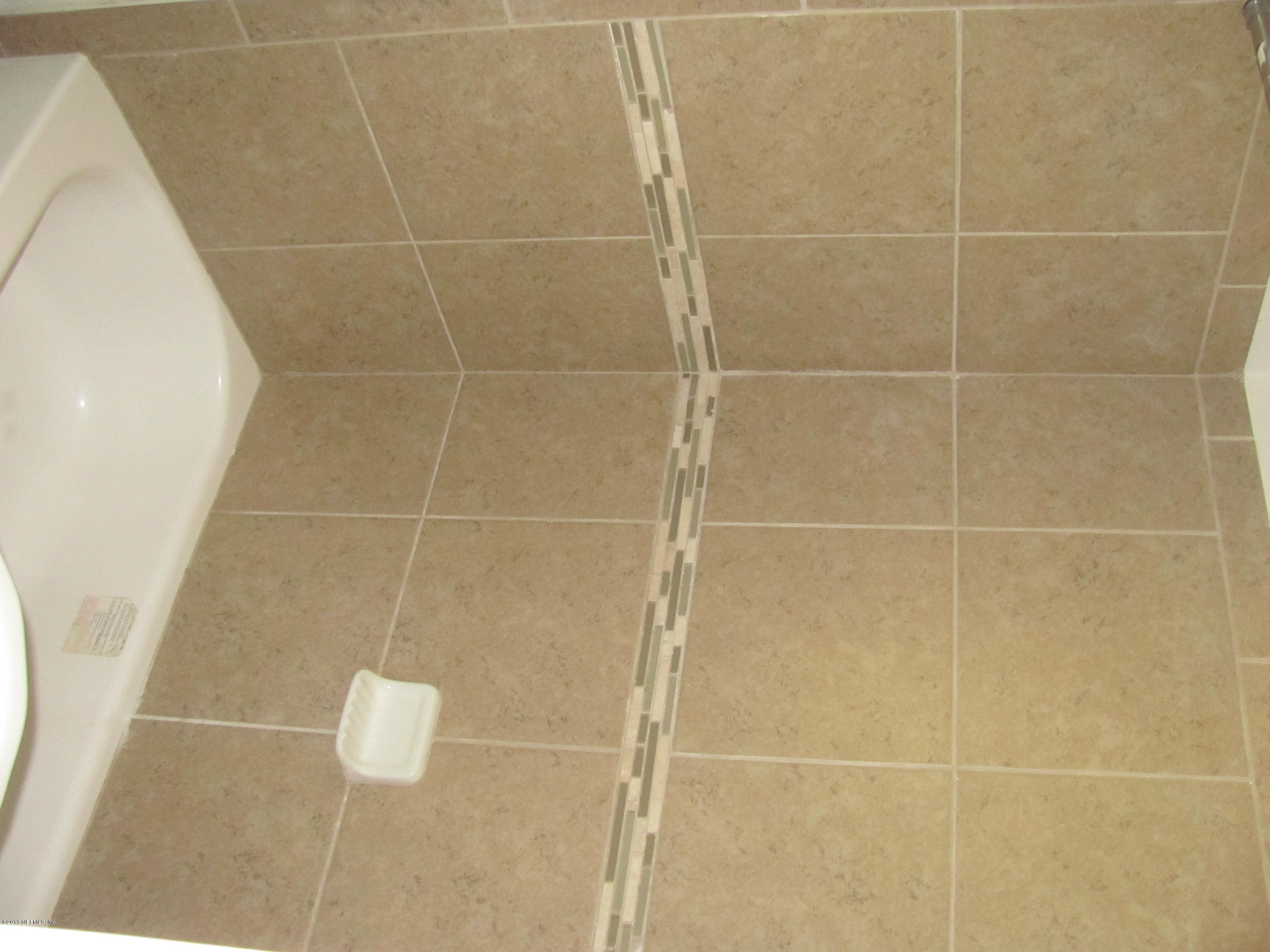 2943 Christopher Road Jacksonville, FL 32217 - Photo 14 of 14 a bathroom with a shower
